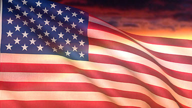 USA flag and sunset or dawn sky