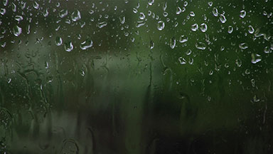 Rain drops on a window during a storm
